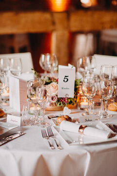Beautiful table number 5 set indoors for reception