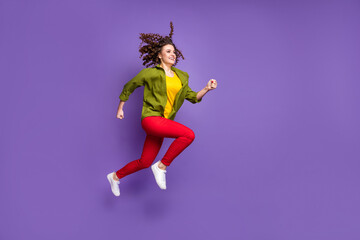 Full size profile side photo of young lovely pretty smiling cheerful girl running in air isolated on violet color background
