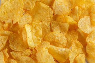 
background from potato chips macro photo. Crispy potato chips snack texture background. Top view. Flat lay