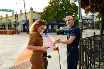 Couple of friends having fun skating the city