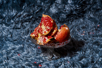 pomegranates on a glass stand