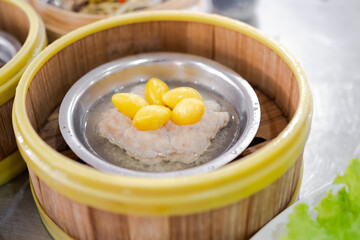 Dim Sum with bean ginkgo biloba and minced pork on bamboo steamer. Chinese cuisine in morning. food for health concept.