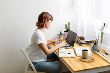 Young woman studying at home
