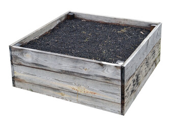 Aged  wooden box filled with  soil for growing plants isolated