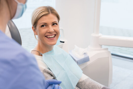 Smiling Patient At Dentist Office