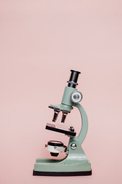 Small Microscope On A pink background