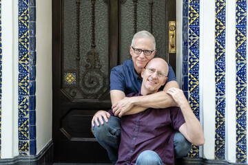 Silver age gay couple hugging