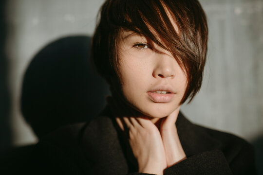 Asian girl in a dark room.