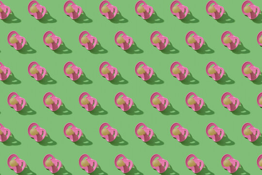 Pattern from plastic baby soothers pacifiers.