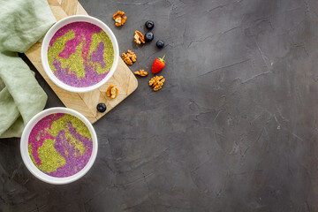 Acai smoothies bowles with chia seeds and superfoods, top view
