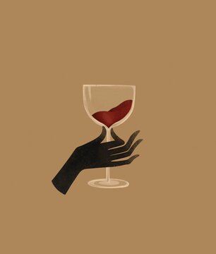 Hand with a glass of red wine