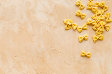 Heap of colored farfalle pasta, top view