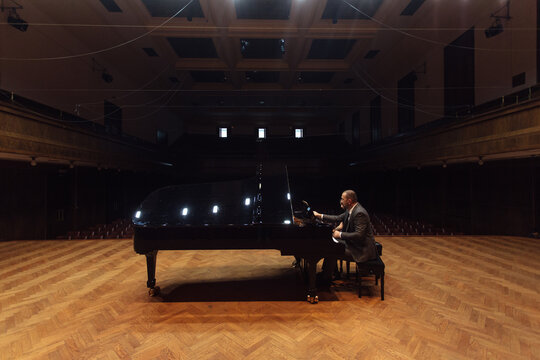 Man and woman, playing a piano