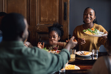 Family Time Is the Best Time - A Woman Giving a Plate with Food to a Man