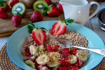 Oatmeal with fruits and nuts in a bowl