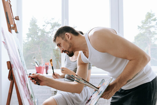 A couple in love in a home art studio