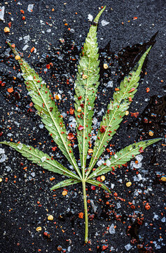 Cannabis leaf with spices and oil