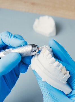 Dental Technician Making New Dental Prosthetics In Laboratory.