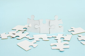 White puzzle on a blue background. Business concept 