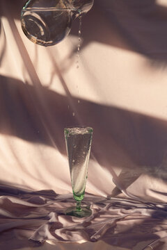 Still life image / Jug filling a full glass
