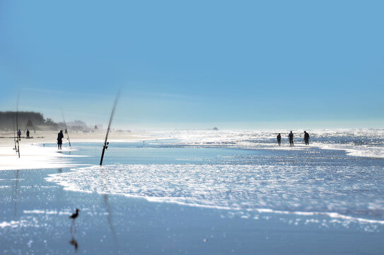 Fishermen catch fish in the Atlantic Ocean in Brazil. Beautiful landscape of blue ocean and sky
