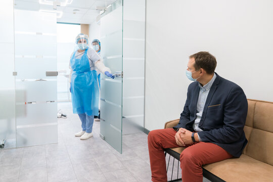 Dentist Inviting Patient To Cabinet