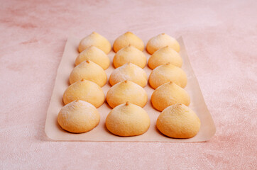 Sponge cookies on a cement background.