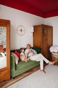 Father and little son together at home.