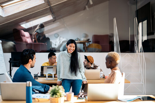 Coworkers Chatting in Office