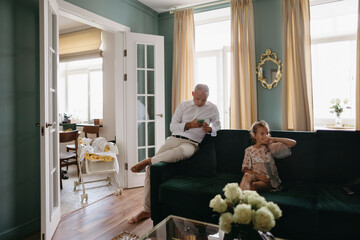 The family is relaxing in a beautiful home interior.