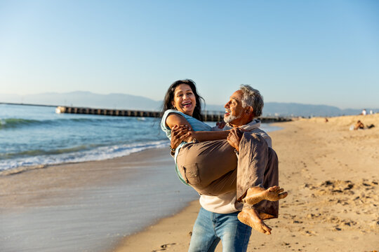 Man Smiles and Holds Woman