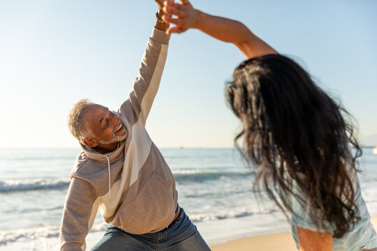 Senior Couple Stretches Together - Powered by Adobe