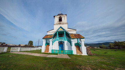 Fototapeta premium Barguzinsky district of Buryatia, Chitkan village. Nativity of Christ Church in the center of the valley. The Orthodox Church was built in 1829-1839.