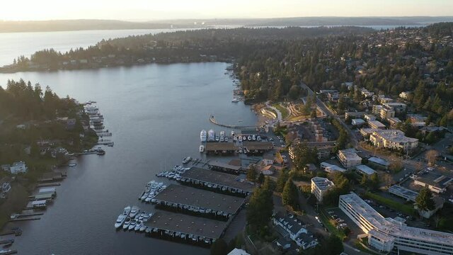 Cinematic aerial drone footage of Meydenbauer Bay Park, Clyde, Eastland, beach park, marinas with Lake Washington Whalers Cove waterfront mansions in Belleview near Seattle, Washington