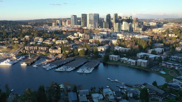 Cinematic aerial drone footage of Meydenbauer Bay Park, Clyde, Eastland, beach park, marinas with Lake Washington Whalers Cove waterfront mansions in Belleview near Seattle, Washington