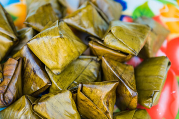 closeup stuffed dough pyramid . Traditional Thai Dessert wrapped.