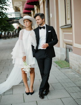 Just married couple walking along the street in the Old City