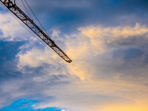 Dramatic sky with crane girder