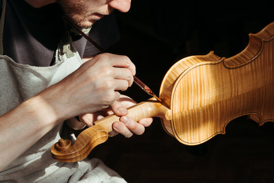 A violin artisan in his workshop.