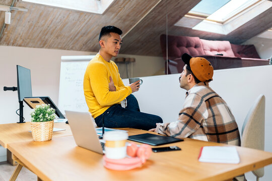 Coworkers Chatting in Office