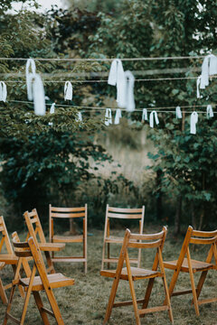 Circle Of Wooden Folding Chairs In The Garden