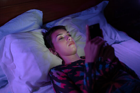 Gen Z woman using her phone
