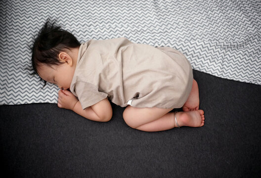 Cute Asian Little Boy Sleeping Soundly In Bed