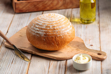 Side view on loaf of olive oil bread on the wooden table