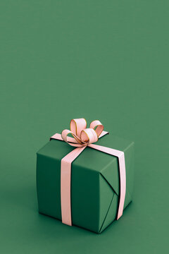 Green And Pink Christmas Gift On Green Background