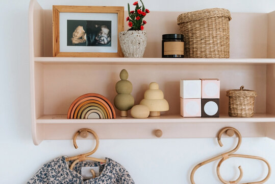 Pink little shelf with kids stuff
