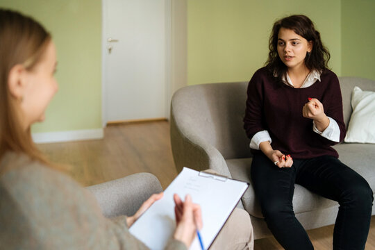 a woman has a lively conversation with a psychologist