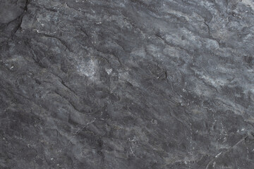 Dark grey black stone background.