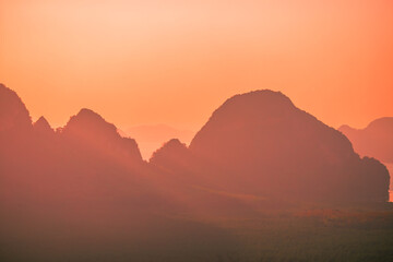 The natural background of the morning light rising in the middle of the sea and surrounded by mountains, cool breezes, the beauty of the ecology of the tourist attractions.