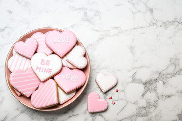 Valentine's day cookies on white marble table, flat lay. Space for text